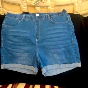 Women Jean shorts, elastic waist band, front and back pockets, cuffed.